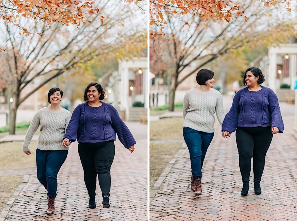 two ladies walking down a brick side walk holding hands