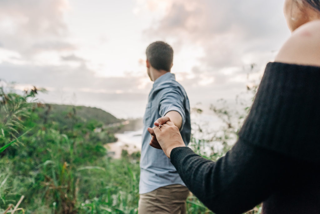 engaged couple on top of a mountain in hawaii
