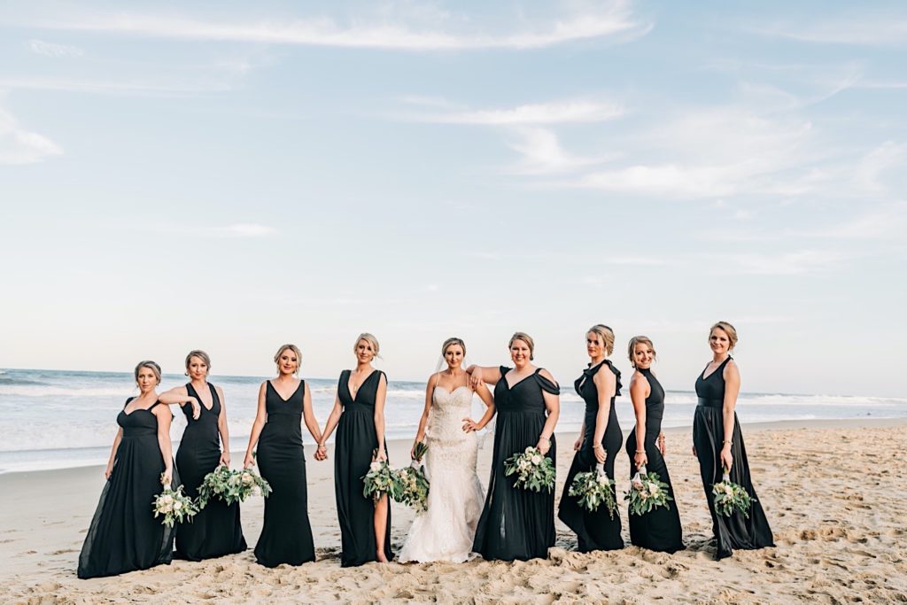 Bridal party portraits on the beach at Jennette's Pier