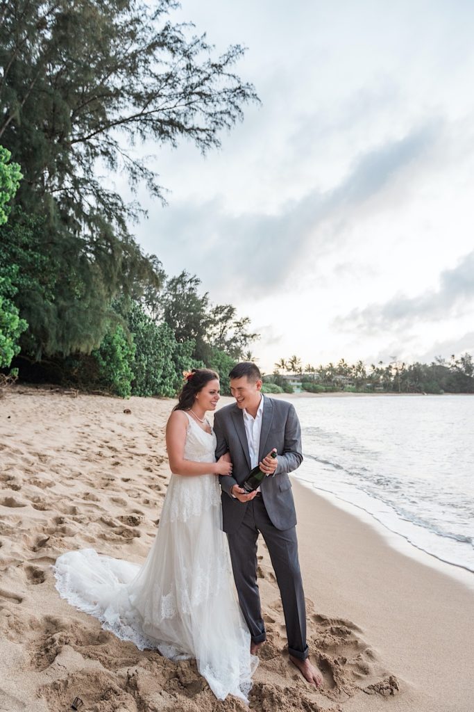 Bride and Groom walking on Hawaii beach