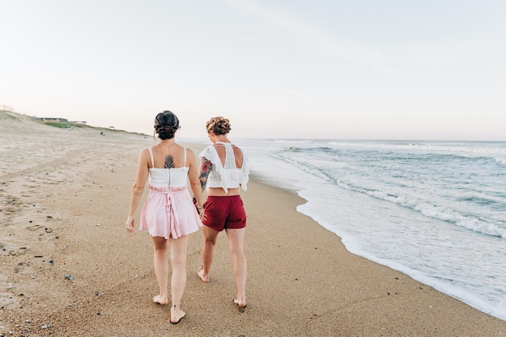 brides walking on beach in OBX