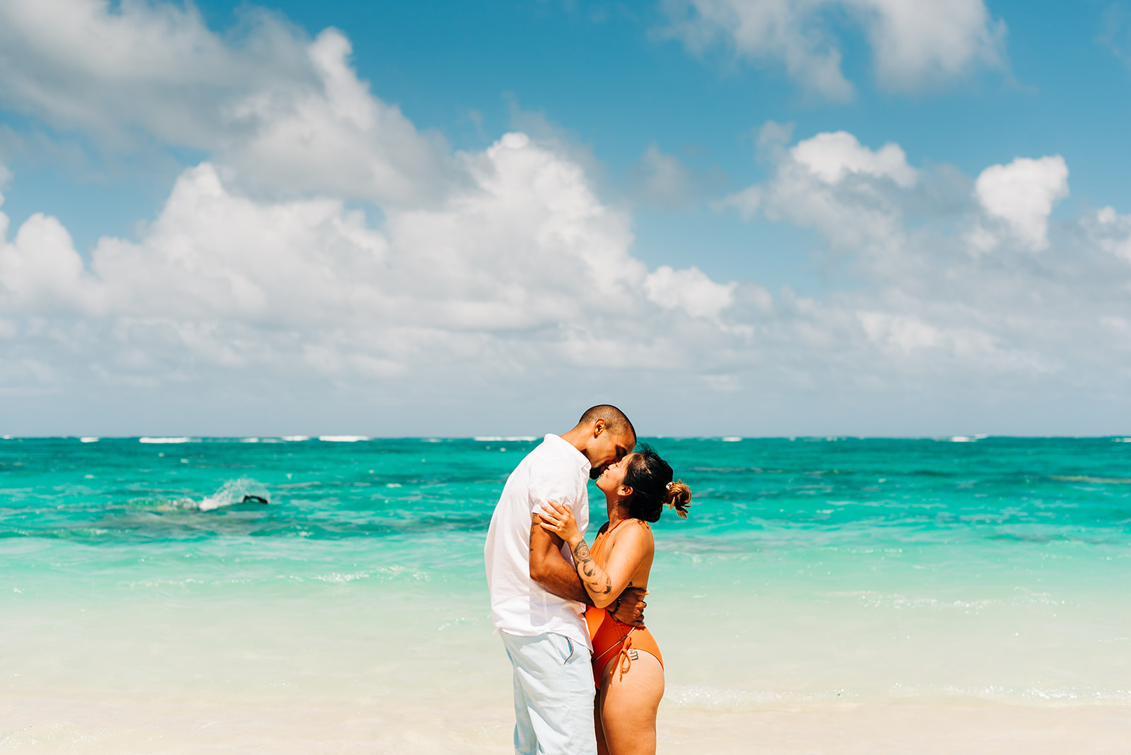 a couple kissing after getting engaged