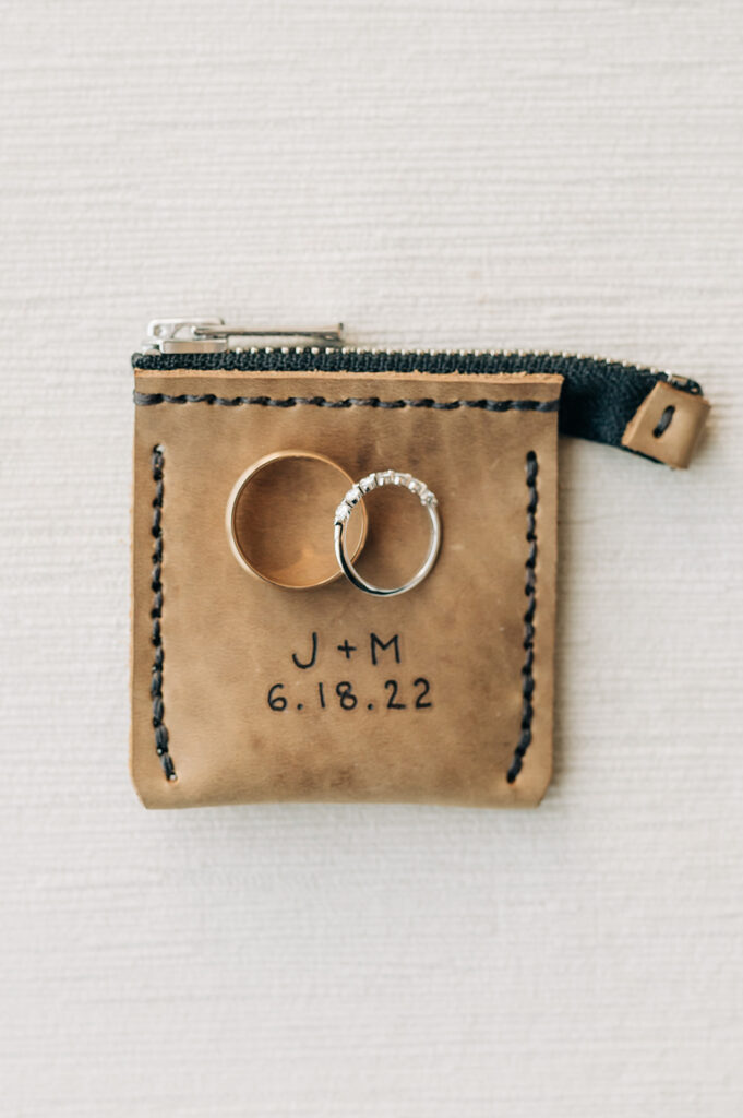 Custom leather ring pouch for engagement and wedding rings.