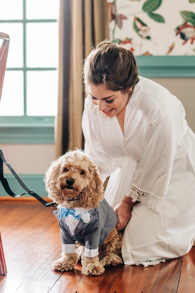 bride with her dog on her wedding day