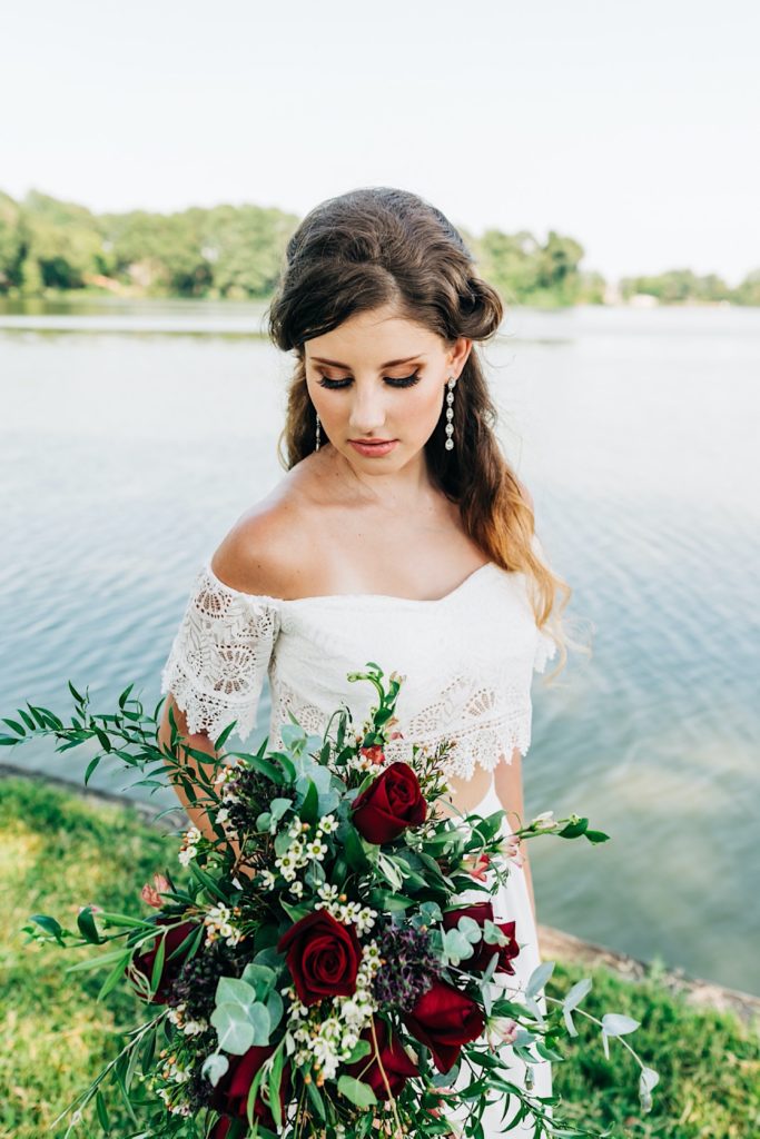 bride next to the water in Virginia with bouquet