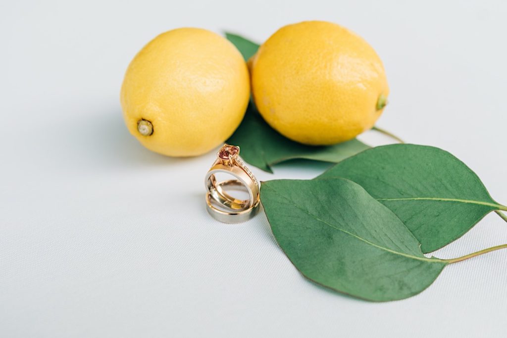 wedding rings next to lemons