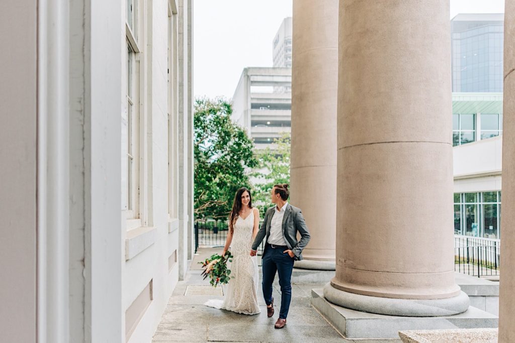 How to get married at the Norfolk VA Courthouse, couple walking out of the courthouse