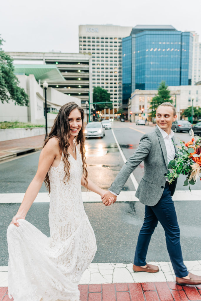 How to get married at the Norfolk VA Courthouse, bride and groom walking across downtown street