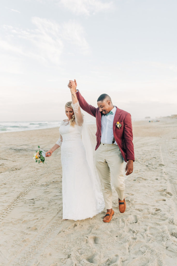 How to get married at the Virginia Beach Courthouse, bride and groom celebrating on the beach