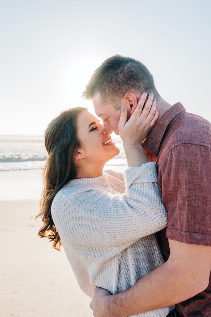 OBX Engagement portraits - couple kissing at sunrise