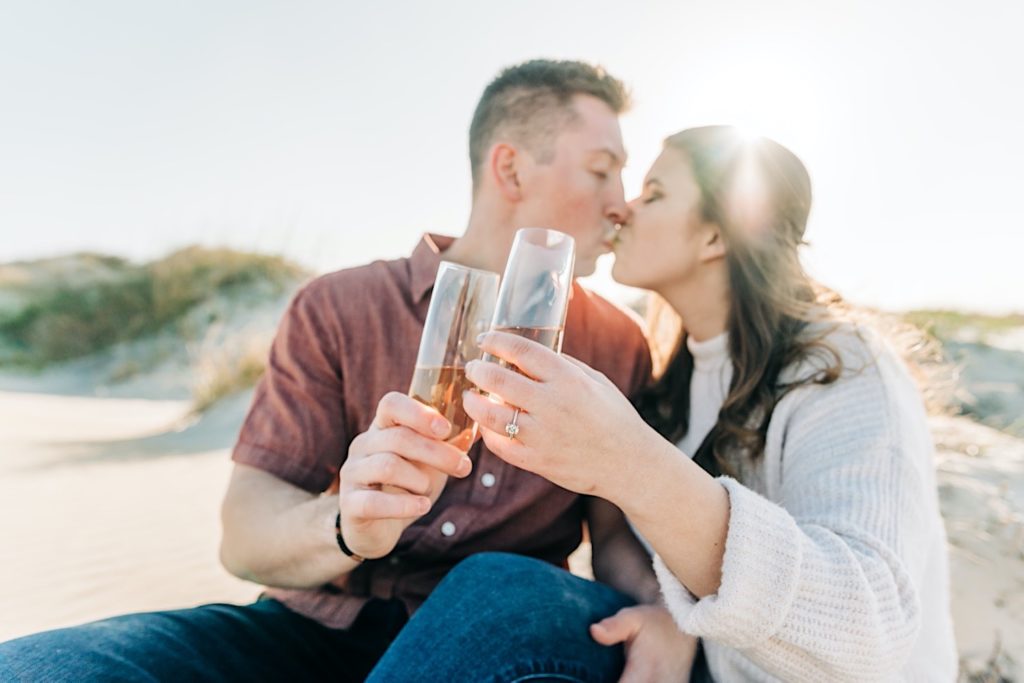 OBX Engagement portraits - couple popping champagne