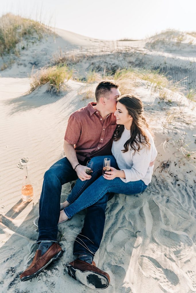 OBX Engagement portraits - couple popping champagne