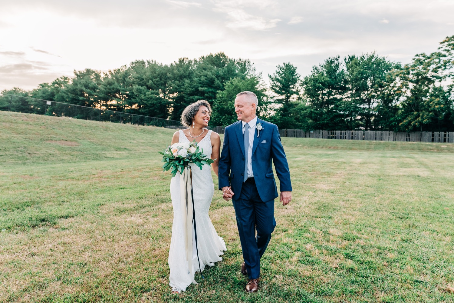 bride and groom walking in Fredericksburg VA