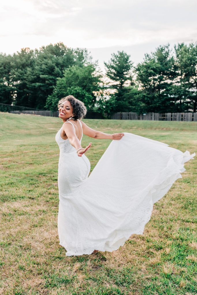 Bride twirling in dress in Fredericksburg VA