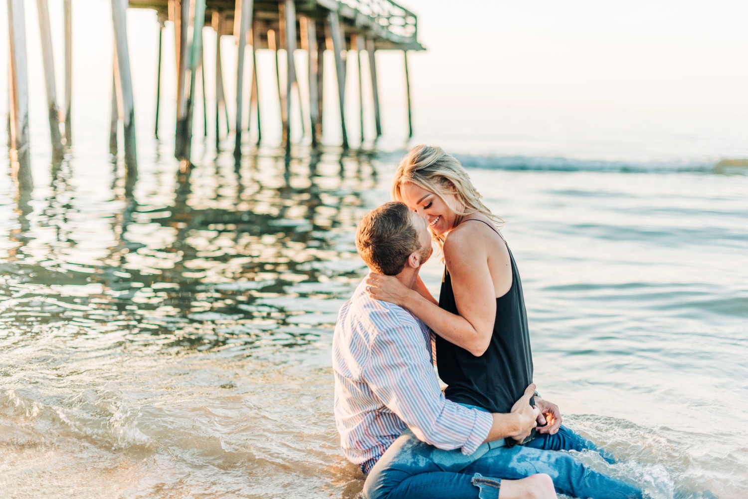 couple kissing in the water at Virginia Beach