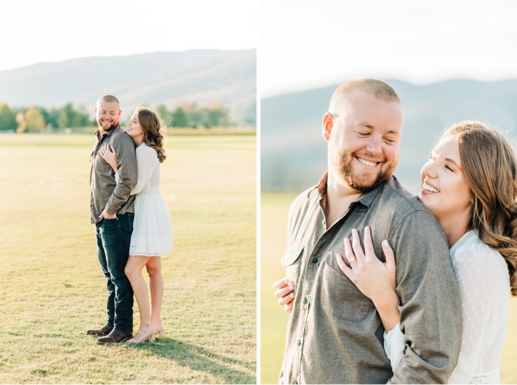 a couple snuggling in a field at King Family Vineyard