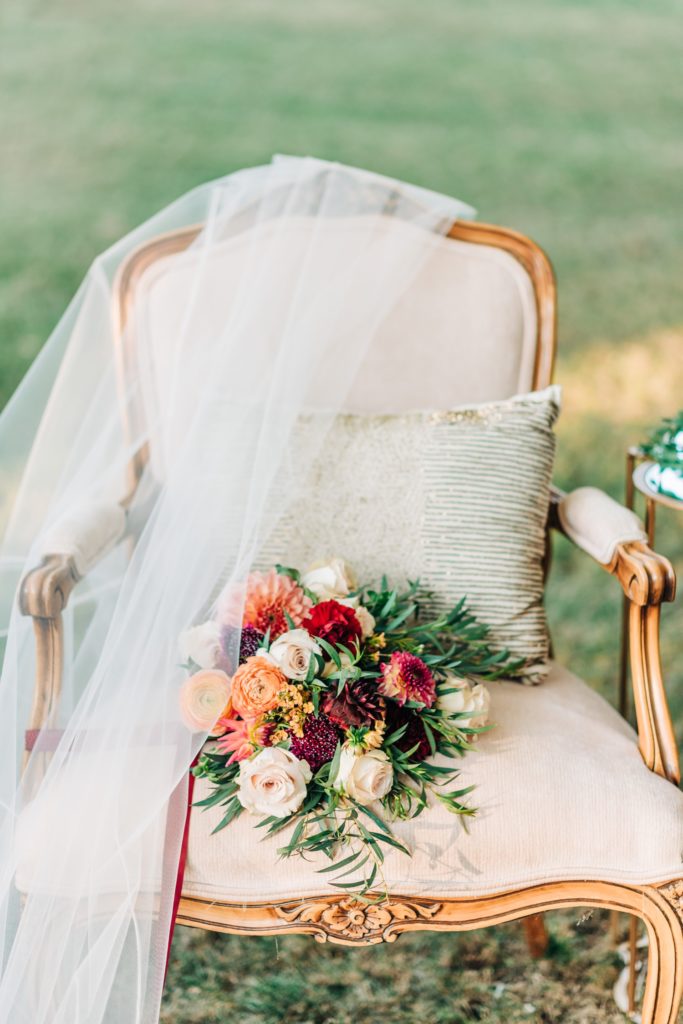 bride's bouquet and veil on a chair
