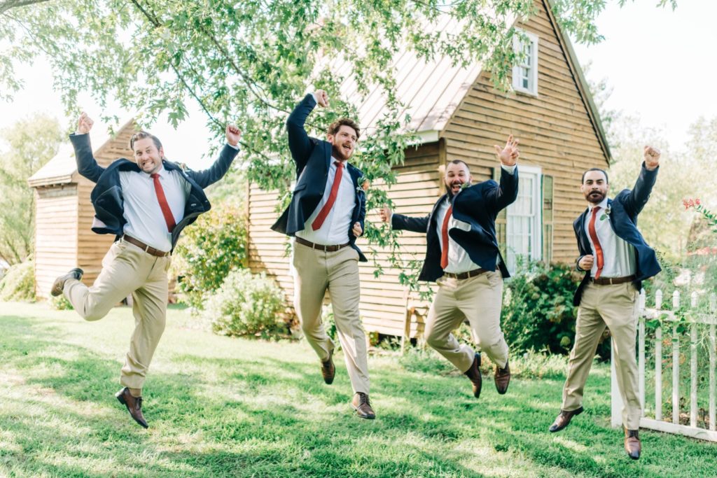 Groom and groomsmen jumping at Clay Hill Wedding