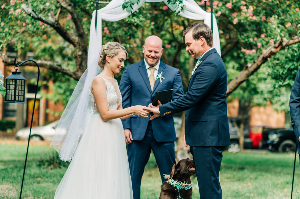 Bride, groom, dog and VA Beach Officiant during the ceremony