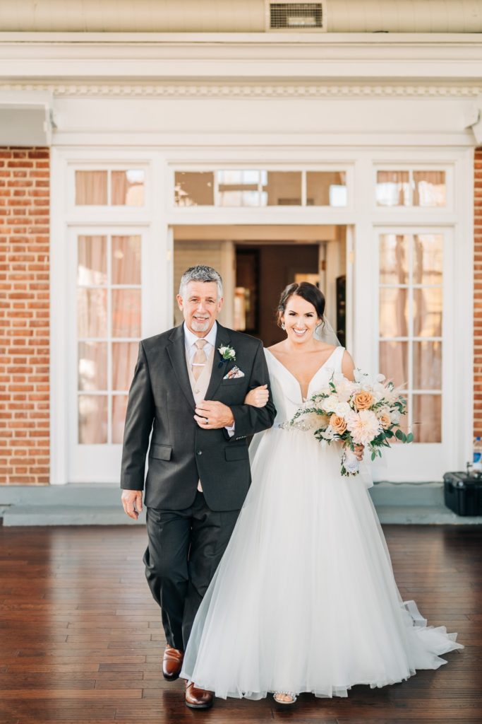 father walking daughter down the aisle at Raspberry Plain Manor