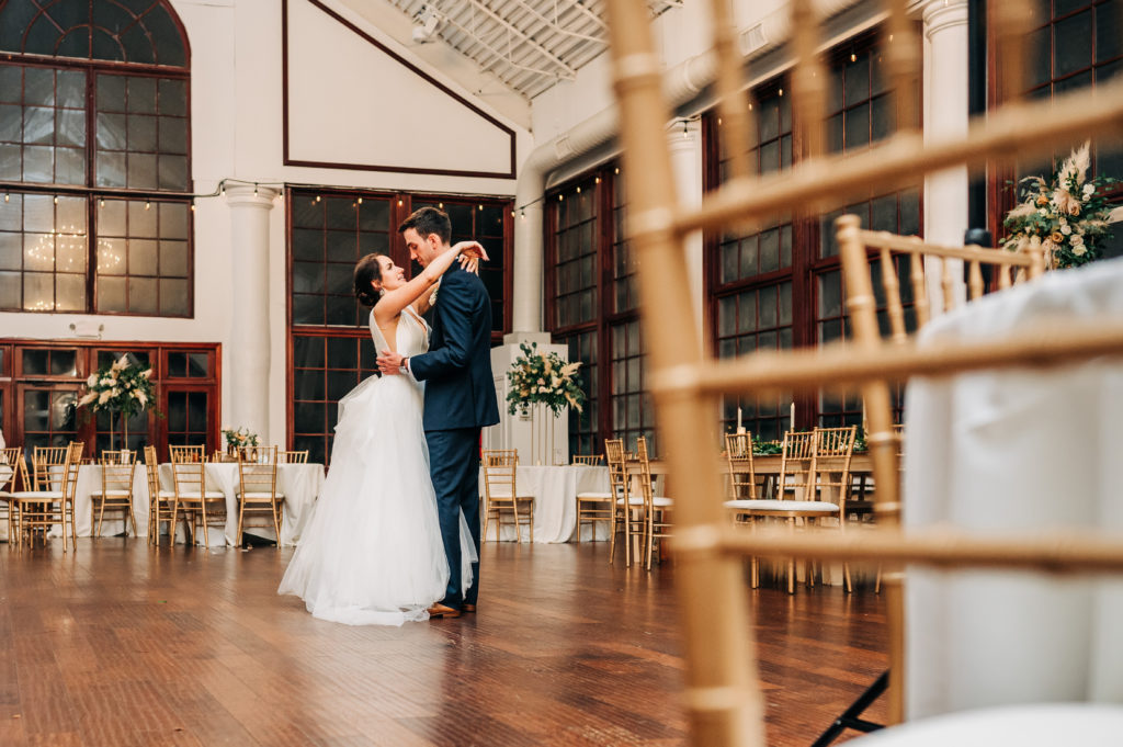 Bride and groom soak up their wedding day with one final dance