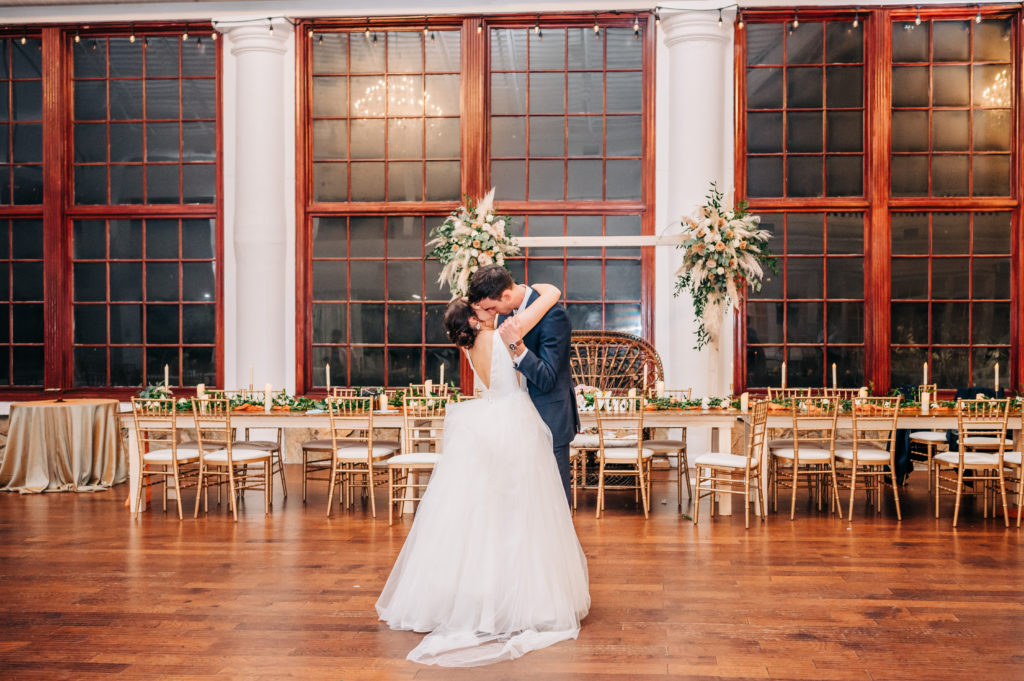 Bride and groom share one last dance to soak up their wedding day.