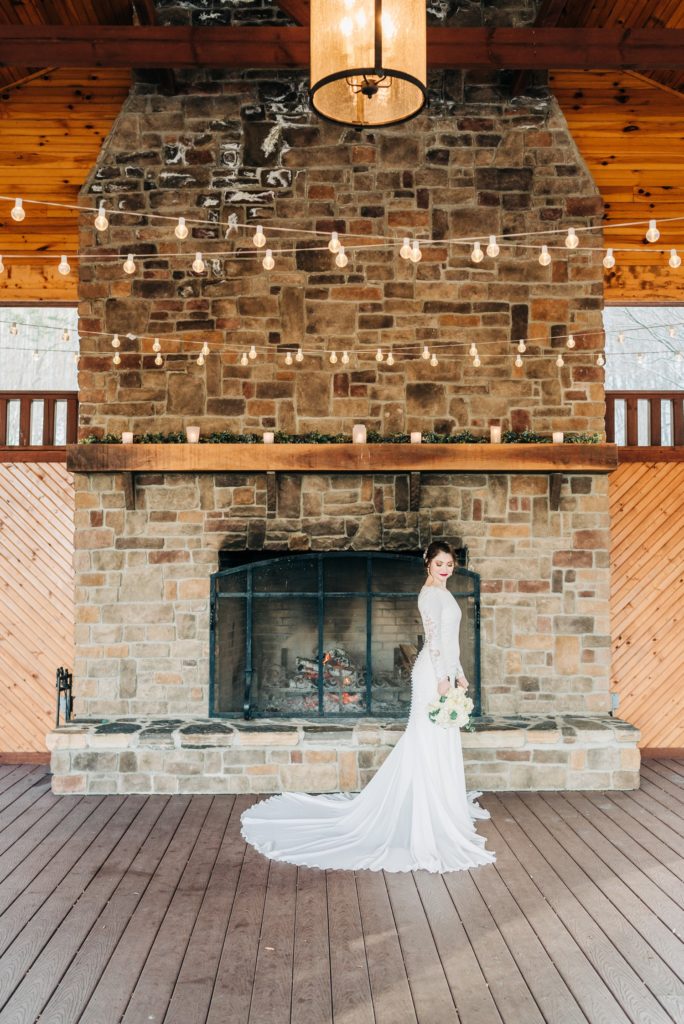 bride in front of the fireplace at Irvine Estate