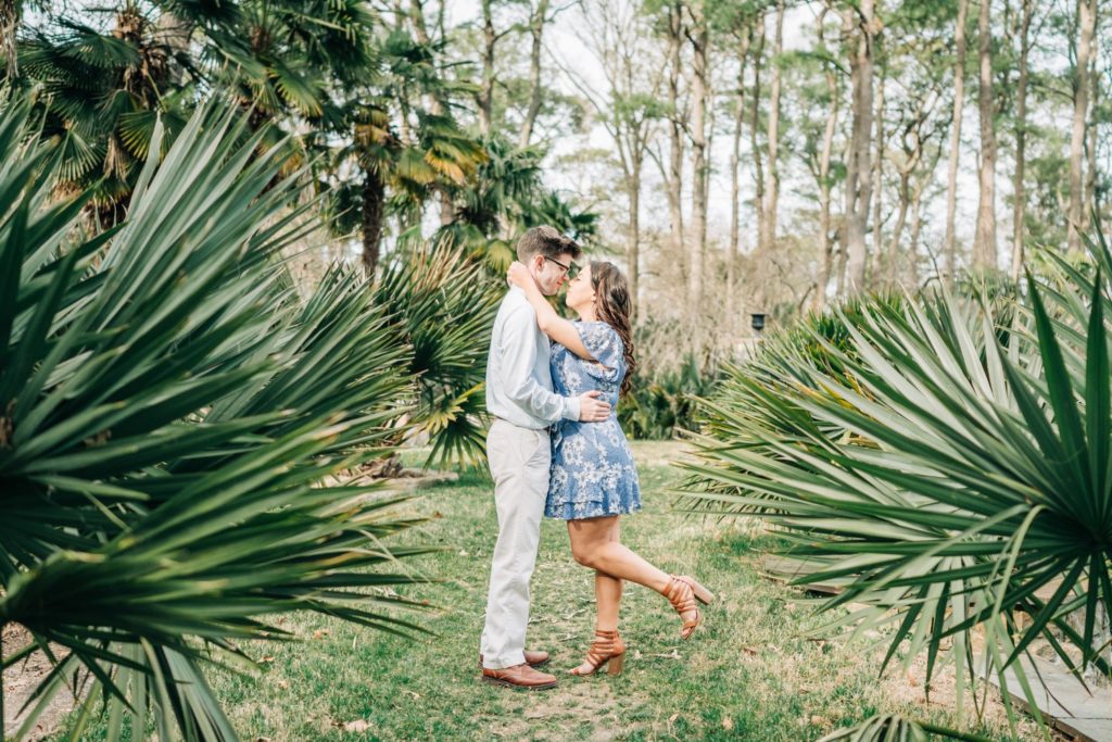 Couple embracing in the botanical gardens in Norfolk, VA