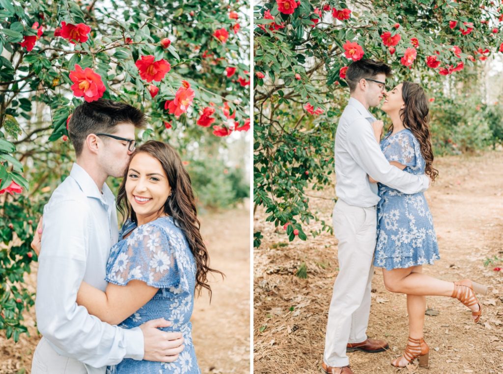 Couple hugging and kissing for botanical gardens engagement photos