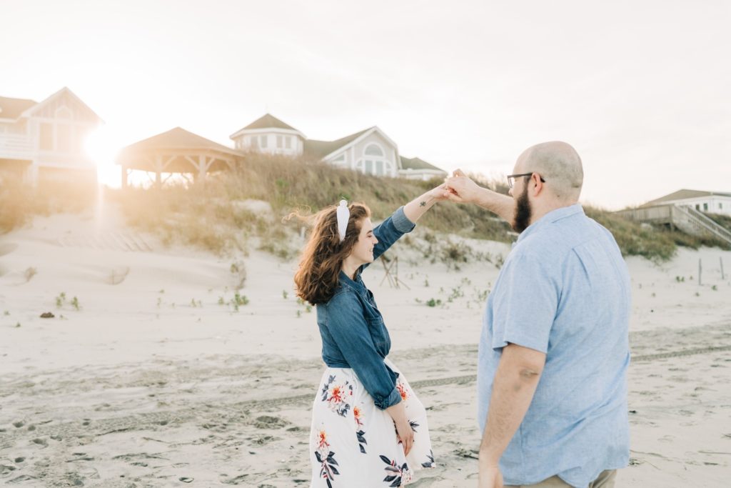 Couple dancing on the beach in Corolla, NC Beach engagement portraits