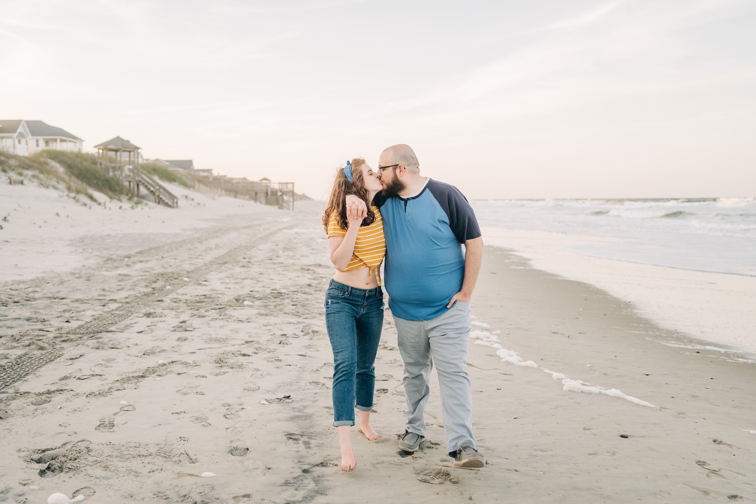 Couple standing on the beach in Corolla, NC beach engagement portraits