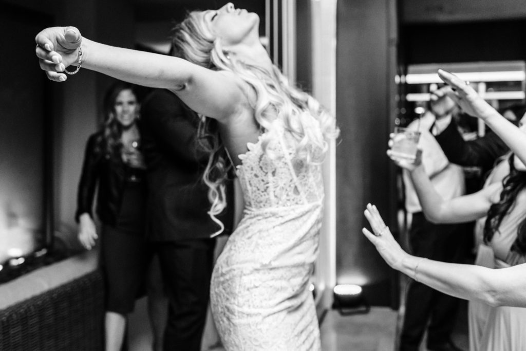black and white photo of bride at reception at downtown charlotte wedding