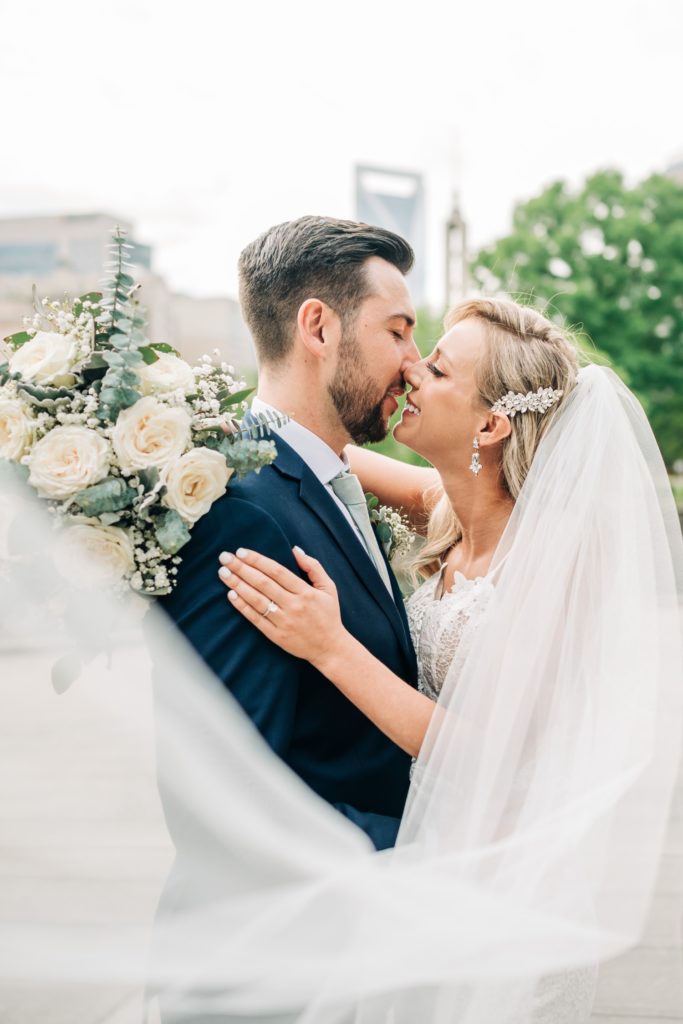 Bride and groom embracing at downtown Charlotte wedding