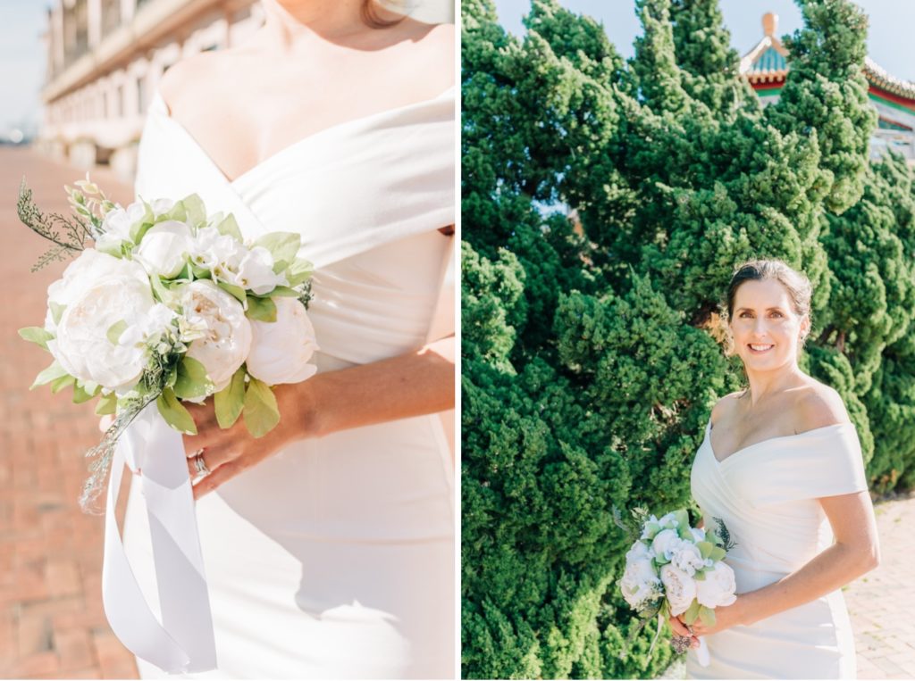 Bride posing with her bouquet in front of greenery in Norfolk, VA