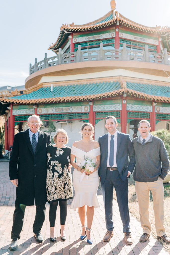 Bride and groom with groom's family after elopement ceremony