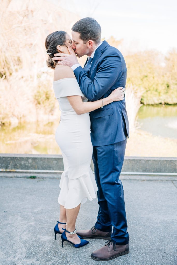 Bride and groom kissing after Norfolk Courthouse elopement ceremony