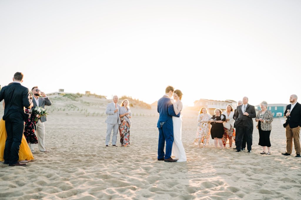 Bride and groom dancing at sunset after Virginia Beach elopement