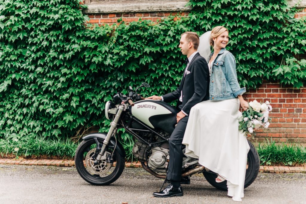Bride and groom on motorcycle at their Hermitage Museum Wedding in Norfolk VA