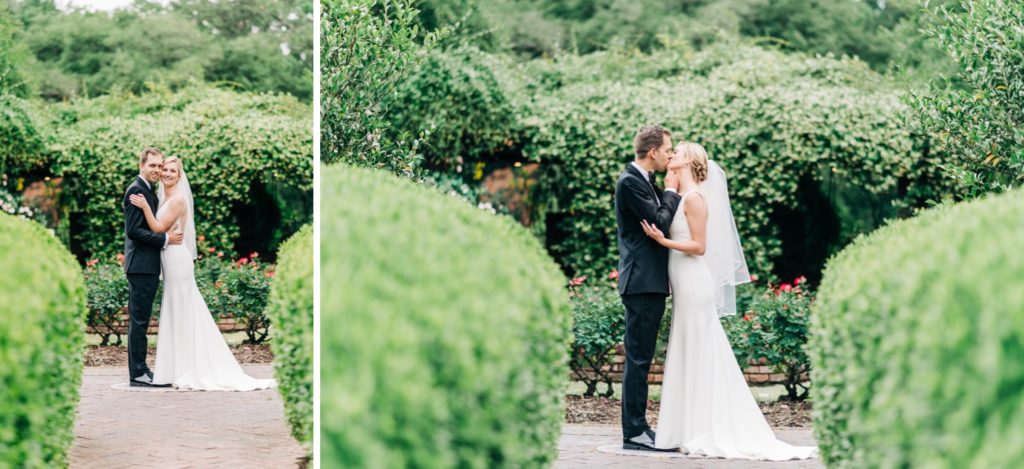 Bride and groom kissing in gardens
