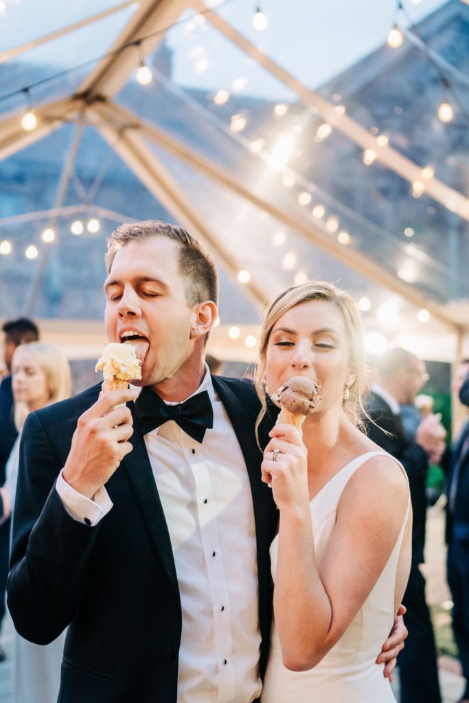 Bride and groom eating their ice cream cones at Hermitage Museum wedding in Norfolk VA