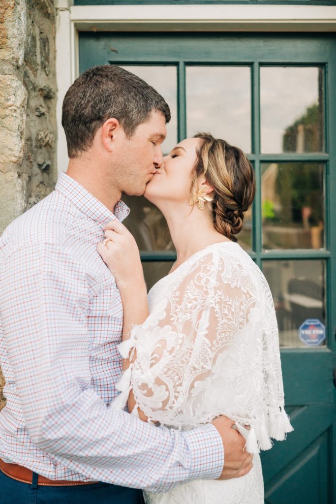 Newly engaged couple kissing during engagement shoot in Middleburg VA