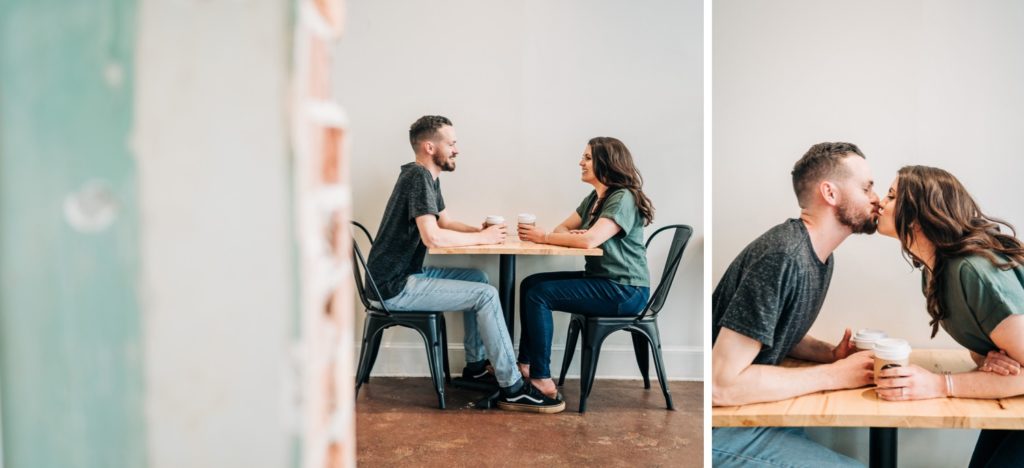 Couple kissing across table in Norfolk VA engagement portraits