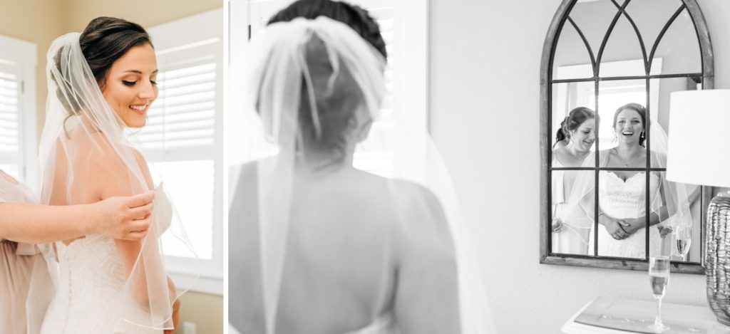 Photo of bridesmaid helping bride with her veil