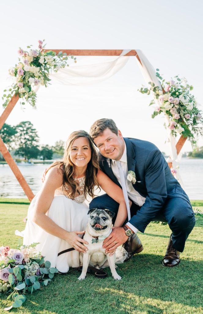 Bride and groom with pet pug
