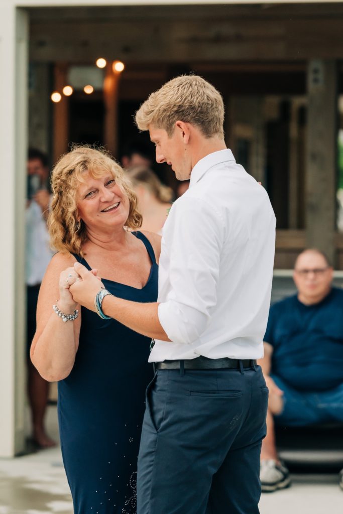 Groom dancing with his mother at wedding reception