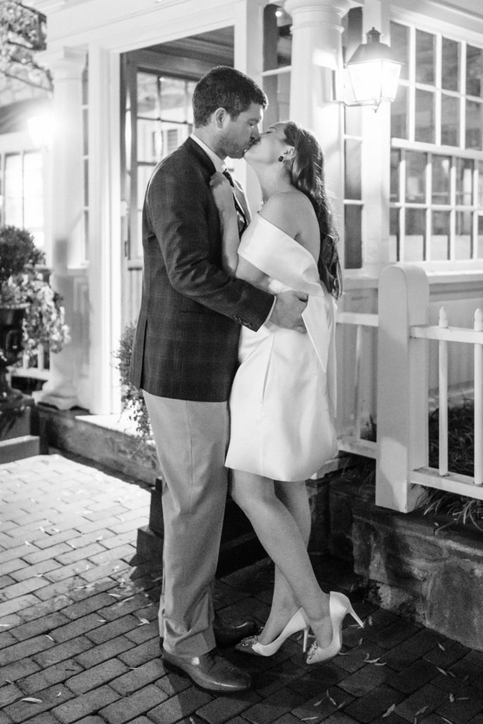 bride and groom kissing outside of Red Fox Inn