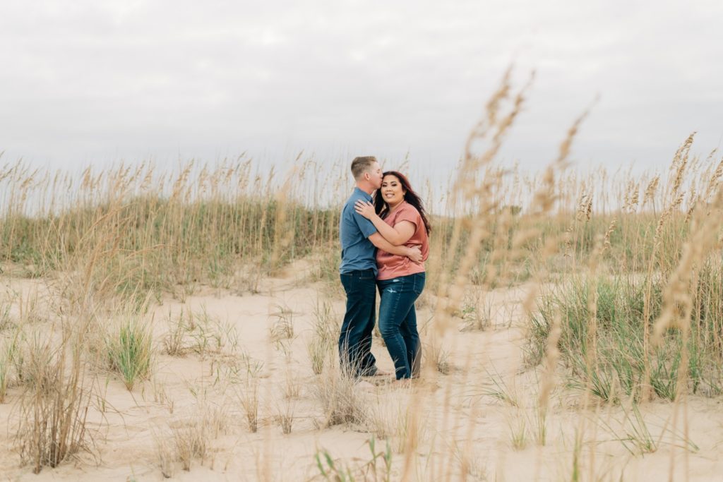 couple hugging for Virginia Beach Engagement Portraits
