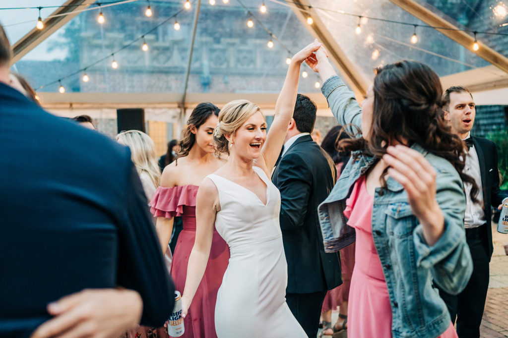 bride dancing with friend at reception