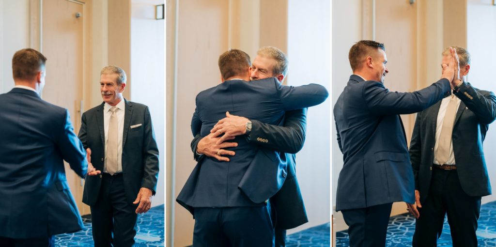 groom and dad hug on wedding day