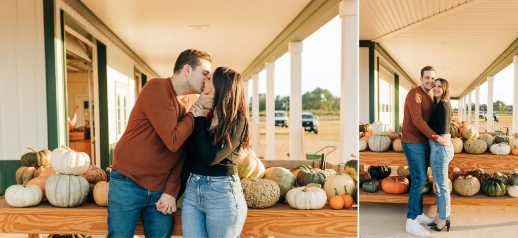 couple kissing at a pumpkin patch